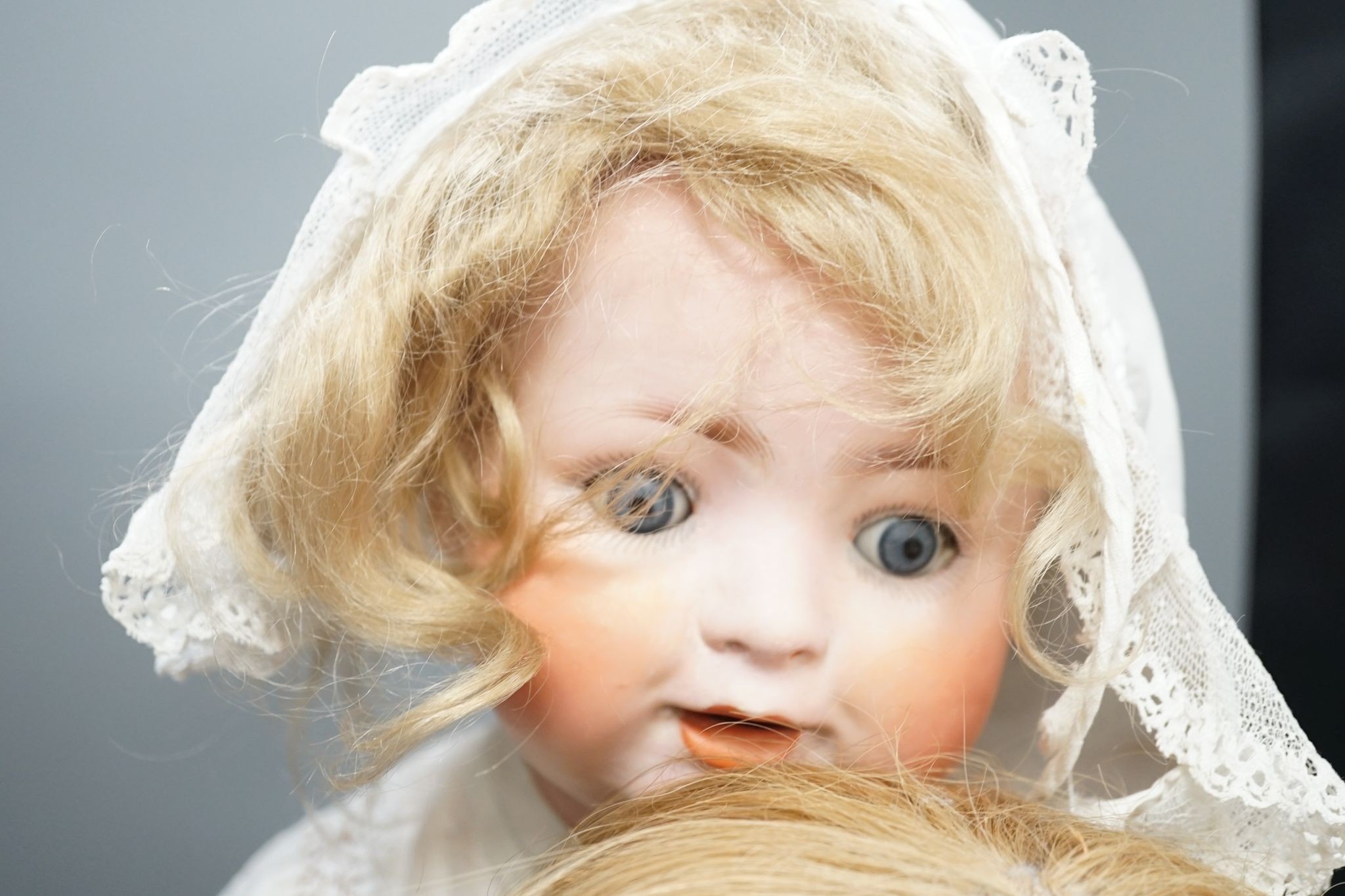 A German Porzellanfabrik Burggrab bisque headed doll, one other bisque headed doll